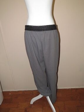 Banana Republic grey pants feature a black faux-leather waistband, Size 12